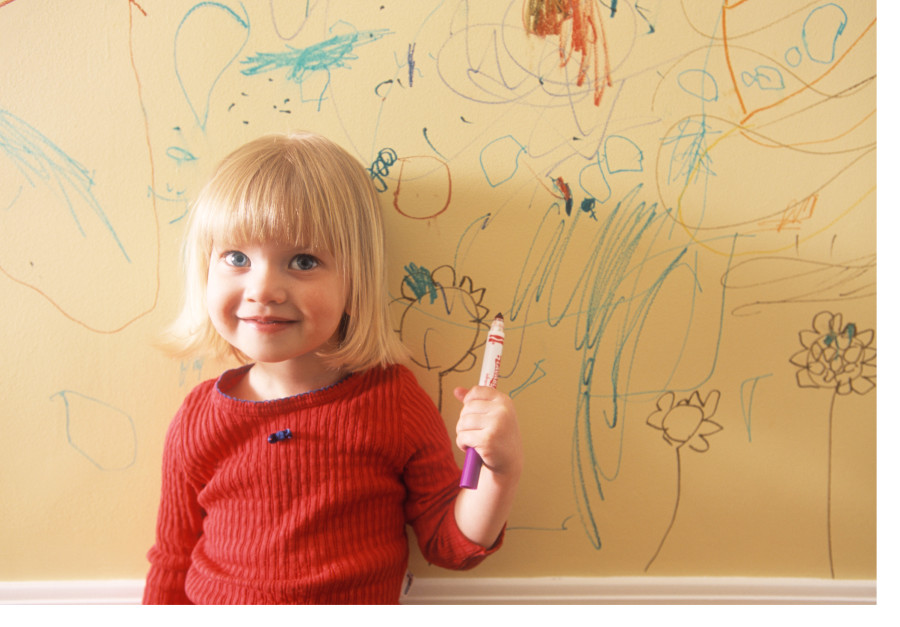 little girl writing on the wall of her house - Different Roads to ...